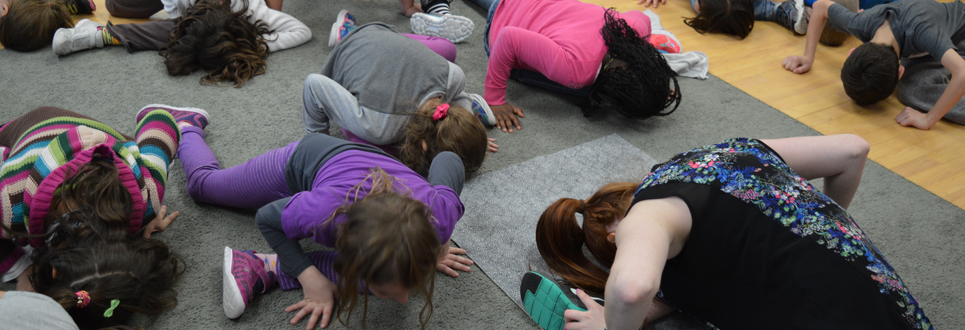 A group of students doing stretches.
