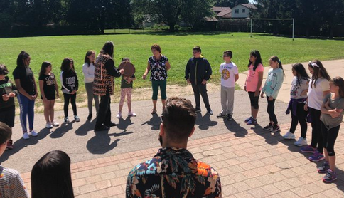 Students doing drumming outside